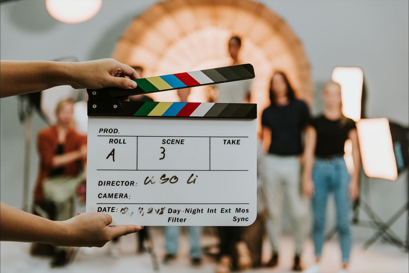 woman-holding-a-movie-production-clapperboard-2022-02-10-06-42-20-utc